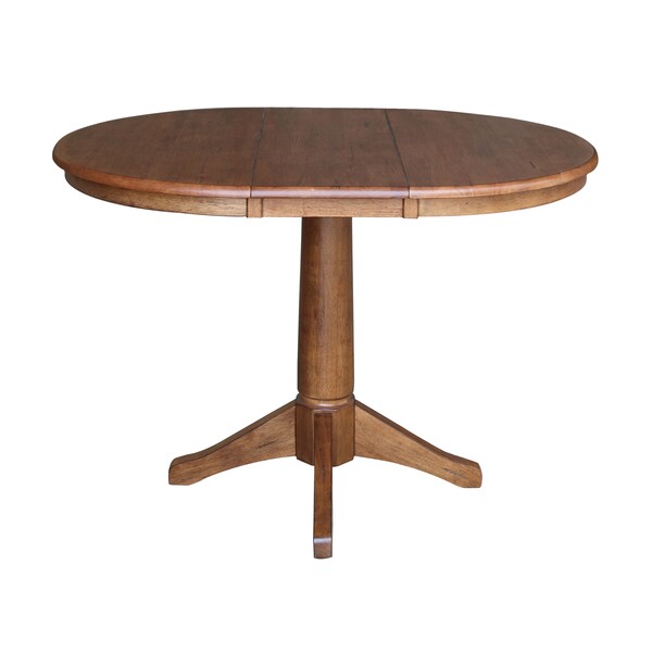 International Concepts Round 36 in Round Top Pedestal Table with 12 in Leaf, 30.1 in H, Distressed Oak, 36 in W, 48 in L - K42-36RXT-27B