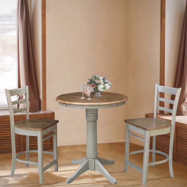 International Concepts Round 30 in Rd Ped Gathering Ht Table, 2 Emily Counter Ht Stools, Hickory/Stone, 30 in W, 30 in L - K41-30RT-27B-S6172-2