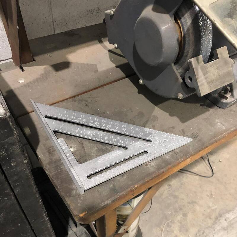 Swanson 25 cm Metric Speed Square, Rafter / Carpenter Square Layout Tool with Plain Markings and Blue Book - NA202