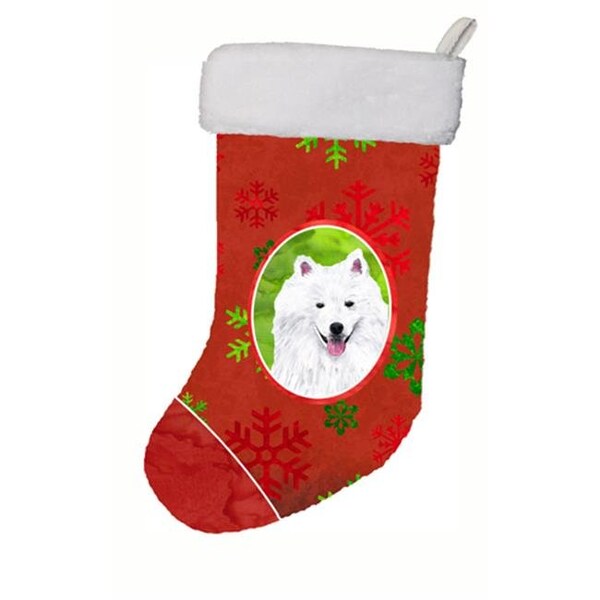 Carolines Treasures Carolines Treasures SC9419-CS 11 x 18 in. American Eskimo Red And Green Snowflakes Holiday Christmas Stocking - SC9419-CS