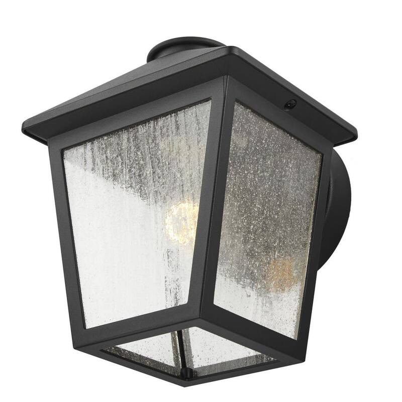 Luz de pared exterior con un candelero Hampton Bay Malena de 7.83 pulgadas y 1 luz en color negro con cableado duro y cristal claro con semillas - 5294503012