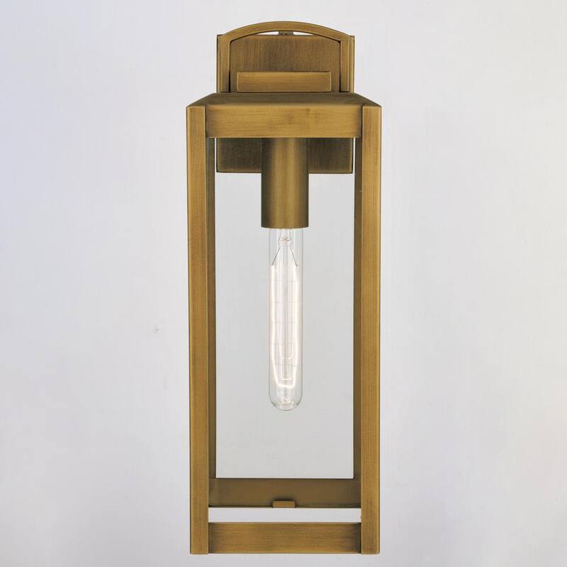 VAXCEL Kinzie 16.75 in. H 1-Light Dusk to Dawn Gold Vintage Brass Hardwired Outdoor Wall Lantern Fixture with Clear Glass - T0707 
Lámpara de pared exterior VAXCEL Kinzie de 16.75 pulgadas de alto con luz de un foco, atardecer a amanecer, estilo vintage de latón dorado, con cristal transparente - T0707
