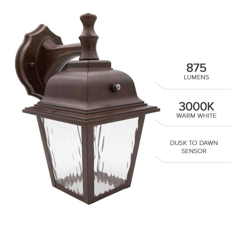 Lámpara de pared de exterior Maxxima de 1 luz en bronce envejecido con sensor de luz y vidrio claro con agua - MEL-9126BW