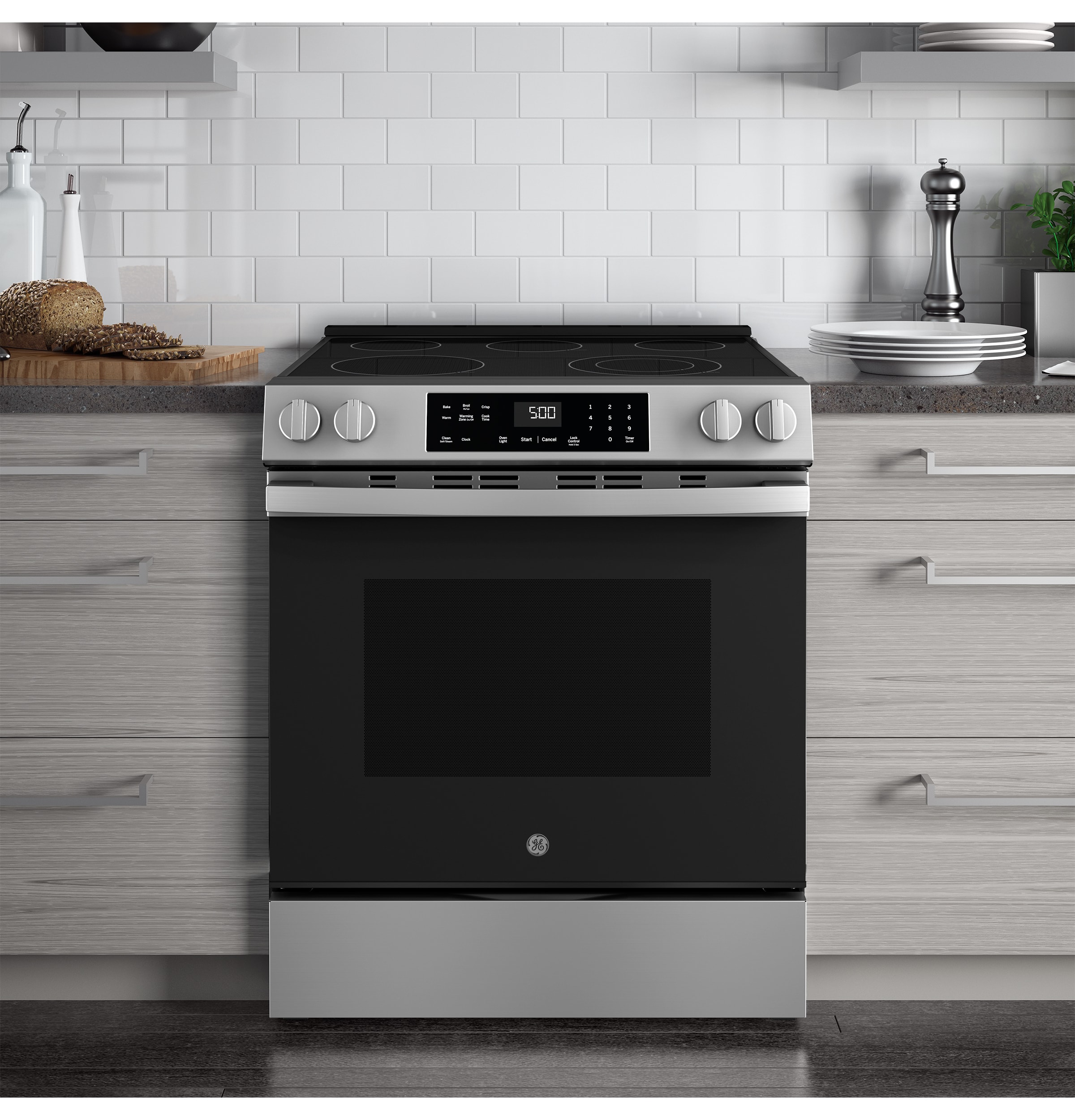 Estufa eléctrica de empotrar con 5 quemadores y modo Crisp Mode de GE de 30 pulgadas, cubierta de vidrio y 5.3 pies cúbicos de capacidad (acero inoxidable)