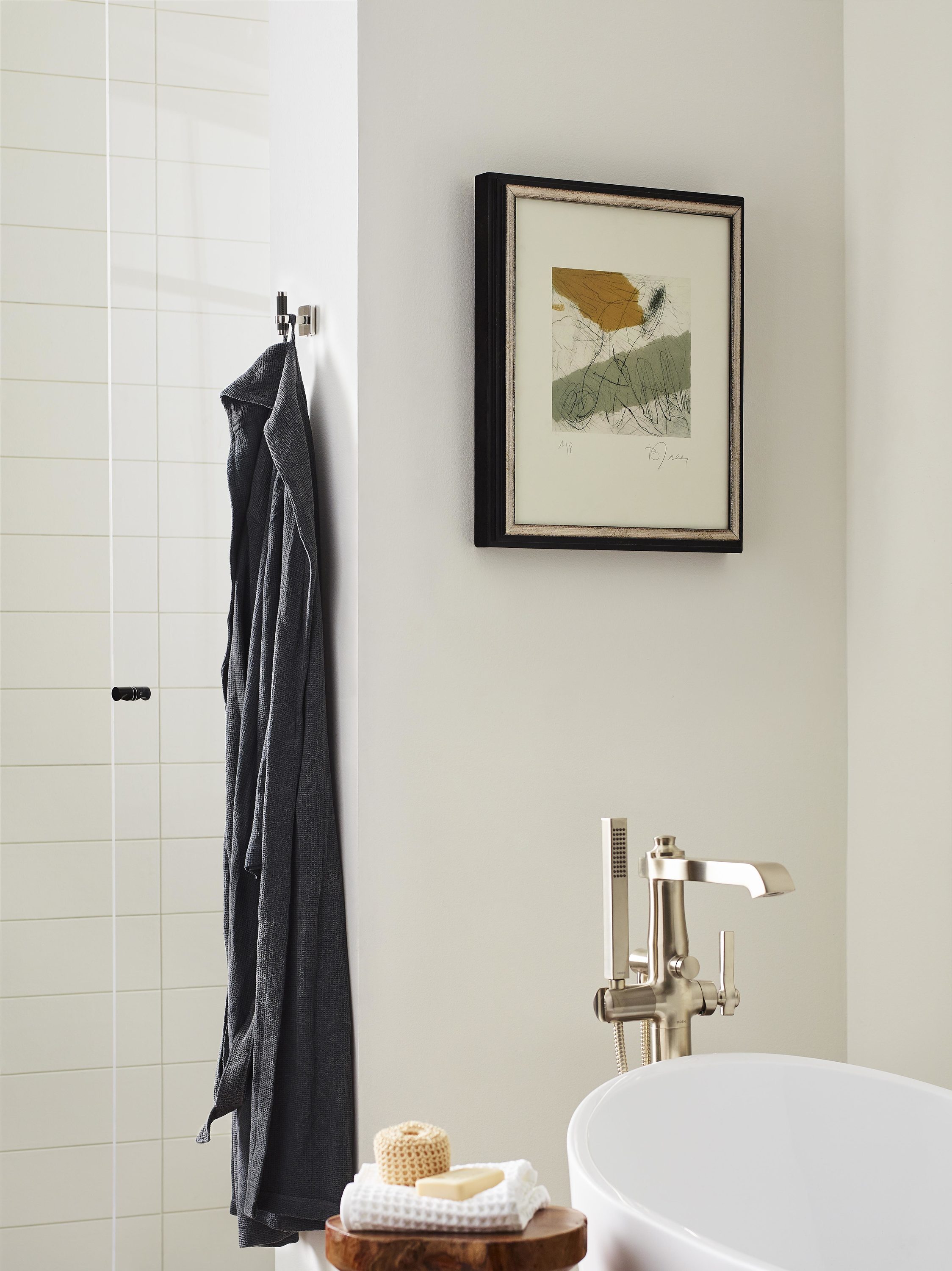 Gancho de toalla montado en la pared, de una sola percha en níquel pulido/bronce negro Esquire de Amerock BH36563PNBBR