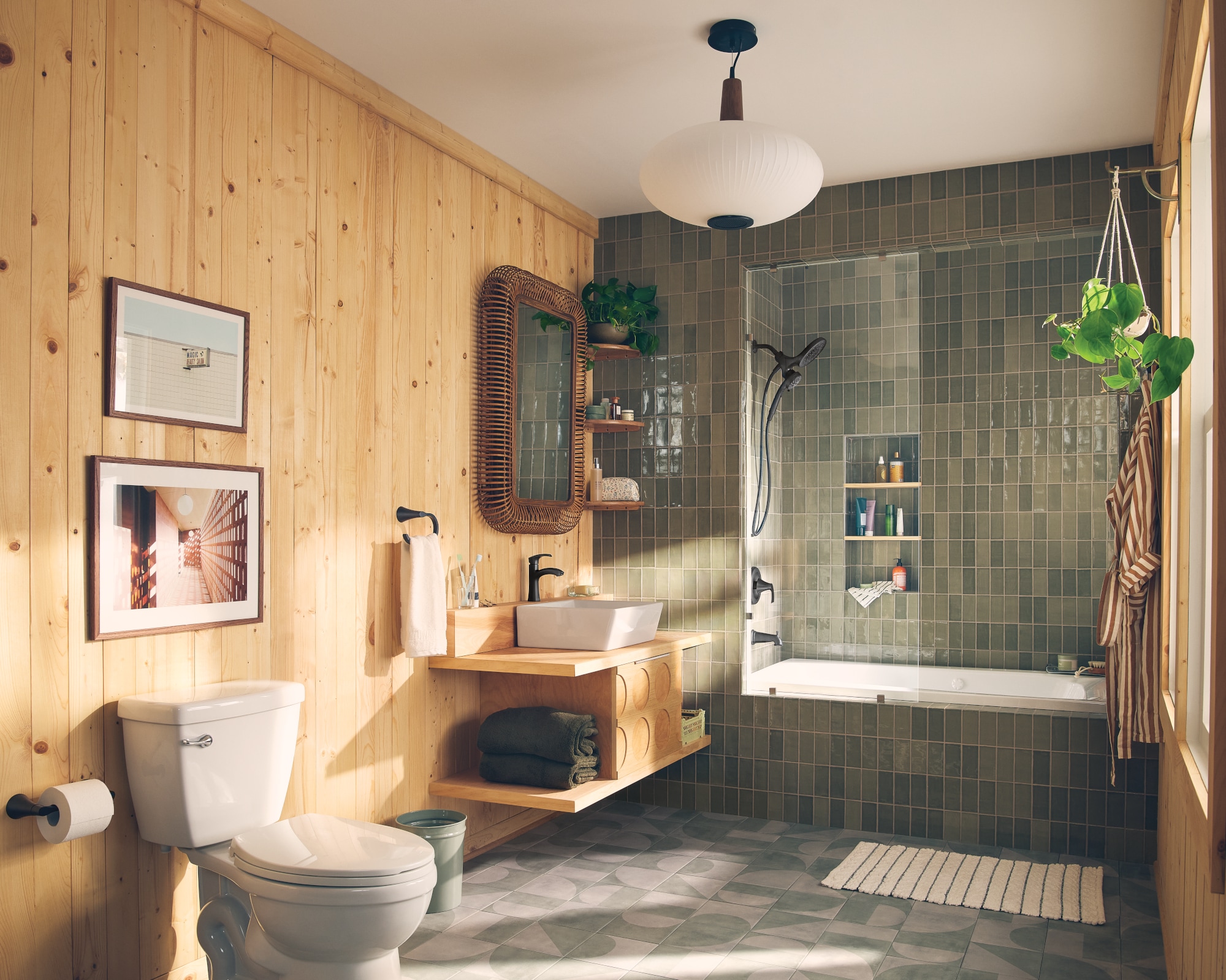 Mezcladora de bañera y ducha redonda de 6.75 pulgadas en negro mate con tecnología Magnetix de Moen Graeden