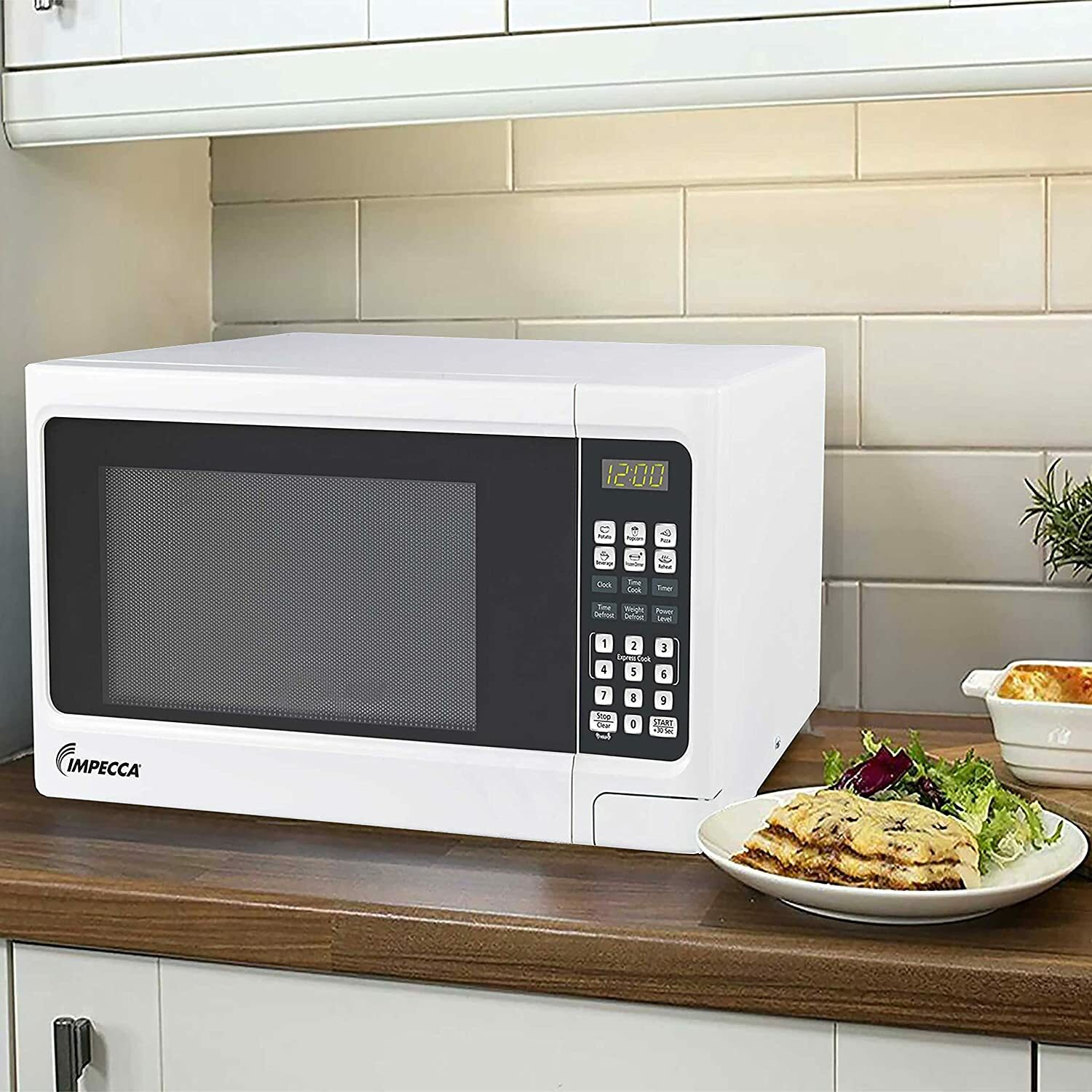 Horno de microondas de 1.1 pies cúbicos y 1000 vatios de potencia media para encimera (blanco)