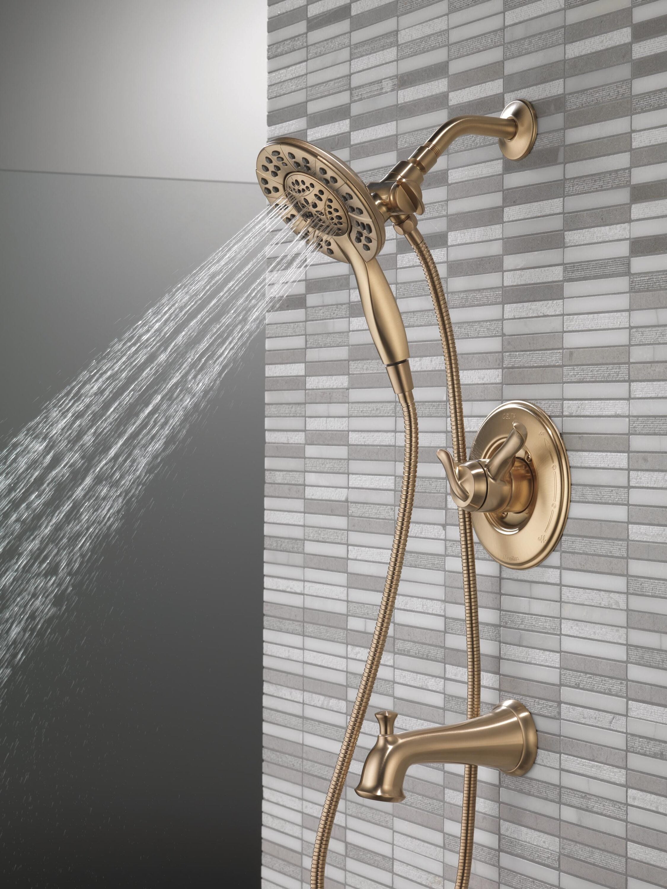 Llave mezcladora de bañera y regadera redonda de 2 manijas en bronce champan Delta Linden 6.1250 pulgadas multi-función T17494-CZ-I.