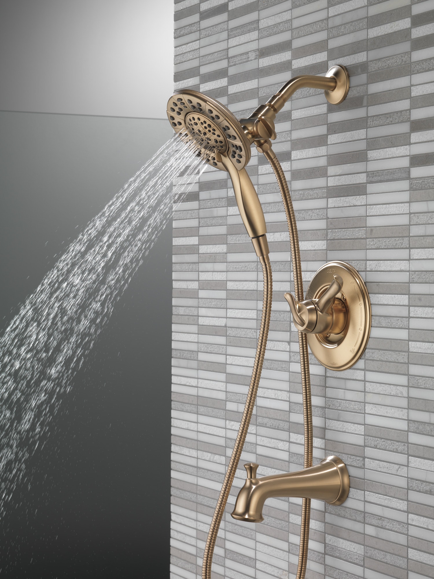 Llave mezcladora de bañera y regadera redonda de 2 manijas en bronce champan Delta Linden 6.1250 pulgadas multi-función T17494-CZ-I.