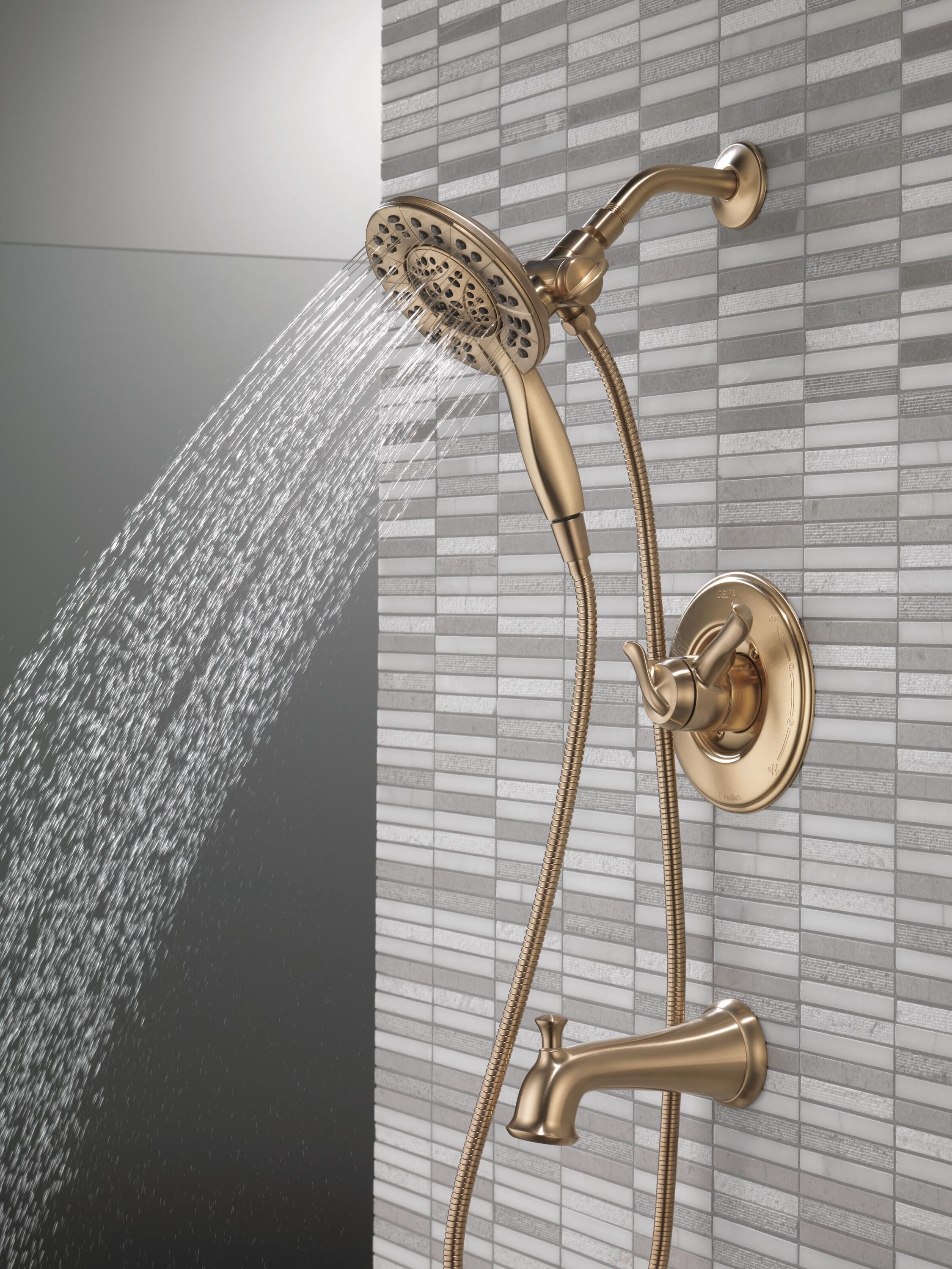 Llave mezcladora de bañera y regadera redonda de 2 manijas en bronce champan Delta Linden 6.1250 pulgadas multi-función T17494-CZ-I.