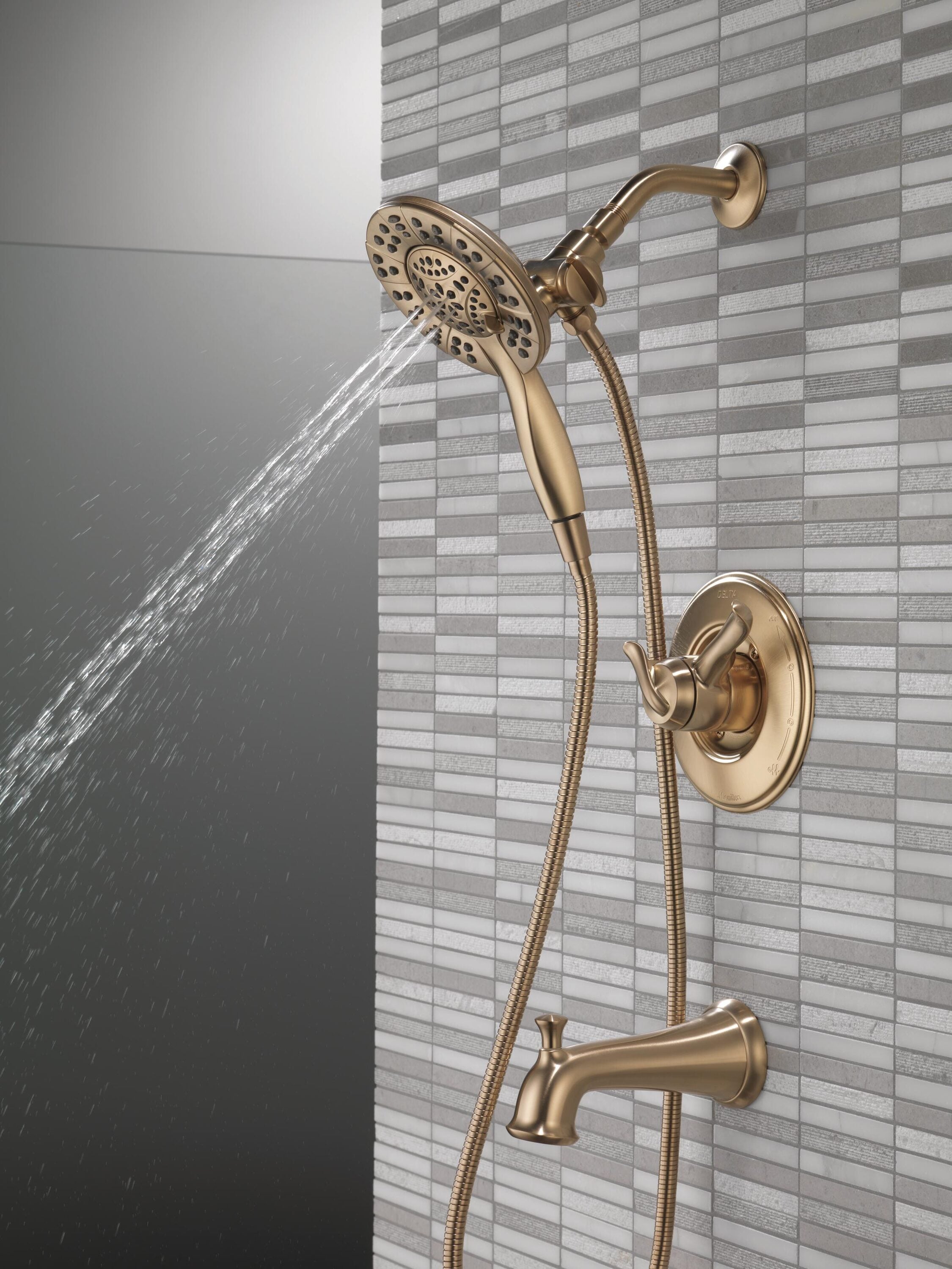 Llave mezcladora de bañera y regadera redonda de 2 manijas en bronce champan Delta Linden 6.1250 pulgadas multi-función T17494-CZ-I.