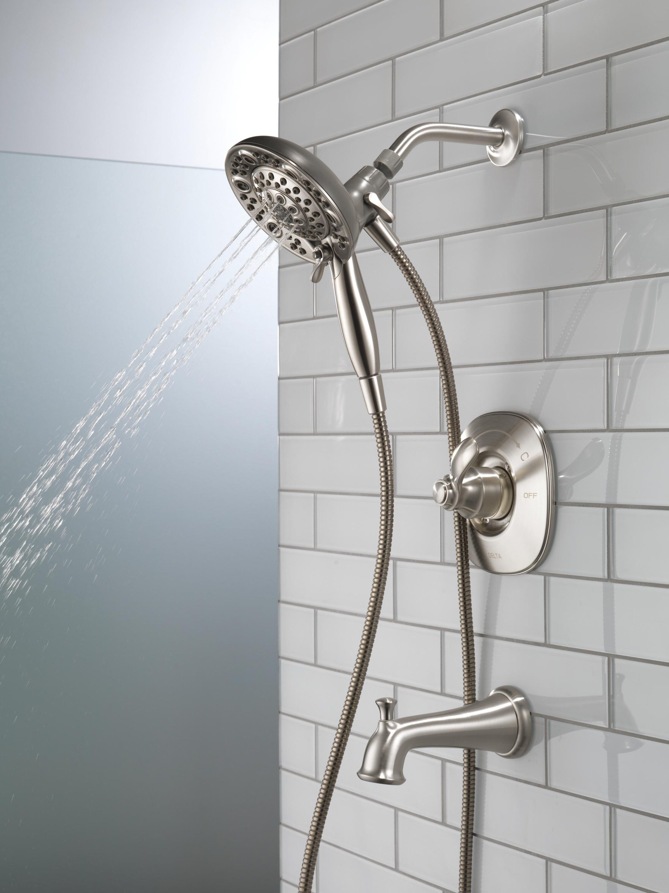 Mezcladora de bañera y regadera redonda de acero inoxidable con una sola manija y funciones múltiples de Delta Nura con Válvula 144710C-SS-I20 de 6.46 pulgadas.