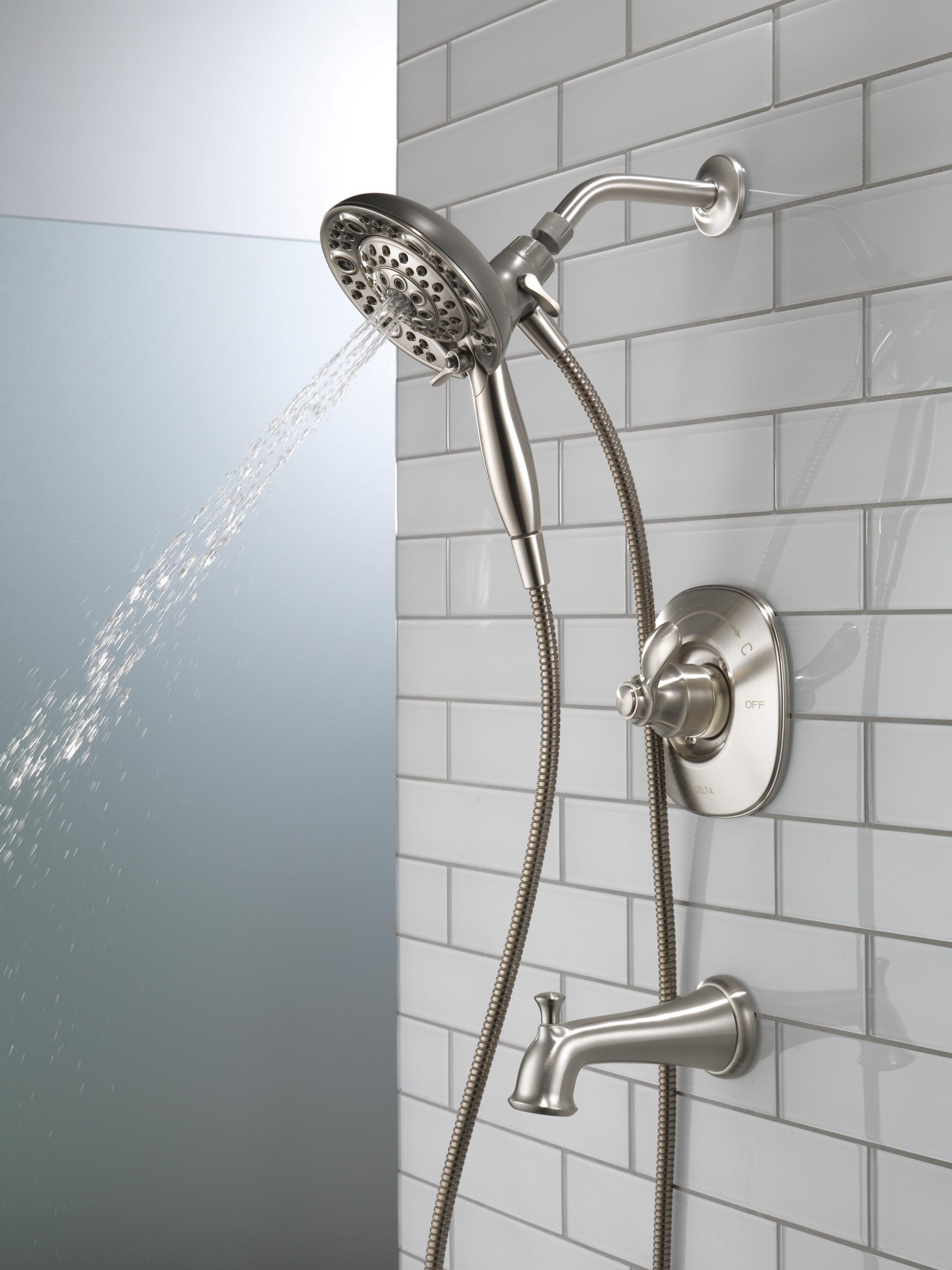 Mezcladora de bañera y regadera redonda de acero inoxidable con una sola manija y funciones múltiples de Delta Nura con Válvula 144710C-SS-I20 de 6.46 pulgadas.
