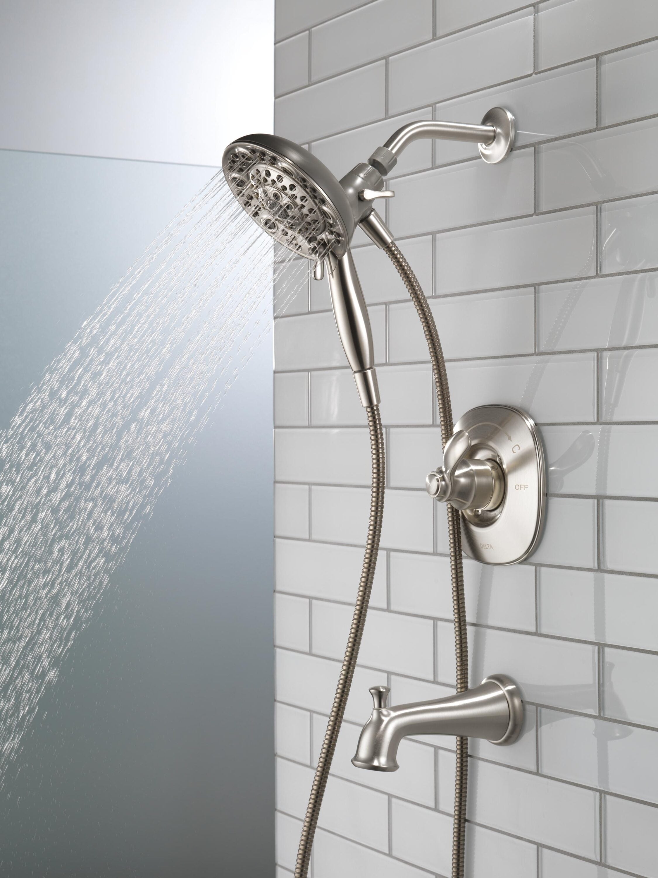 Mezcladora de bañera y regadera redonda de acero inoxidable con una sola manija y funciones múltiples de Delta Nura con Válvula 144710C-SS-I20 de 6.46 pulgadas.