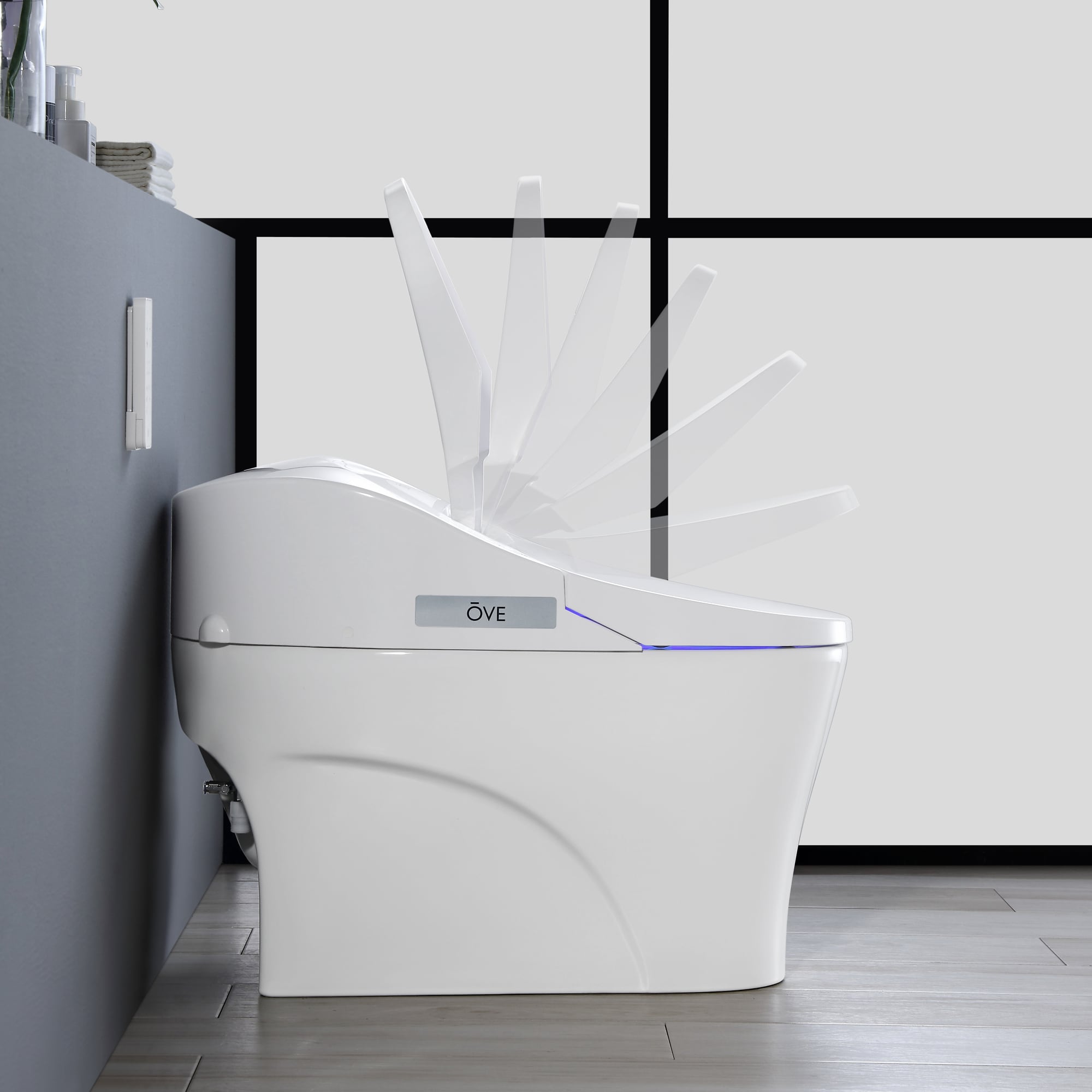 Sanitario alargado individual blanco OVE Decors con cierre suave inteligente, etiquetado WaterSense de 1.28 GPF y conexión de 12 pulgadas.