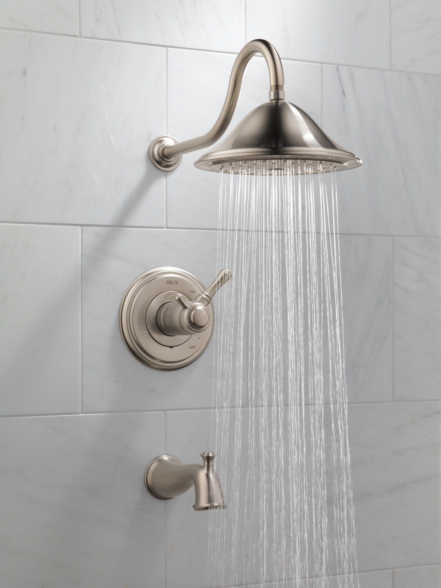 Grifo para bañera y ducha redondo de acero inoxidable con control termostático de 2 manijas y función individual, modelo Cassidy de Delta