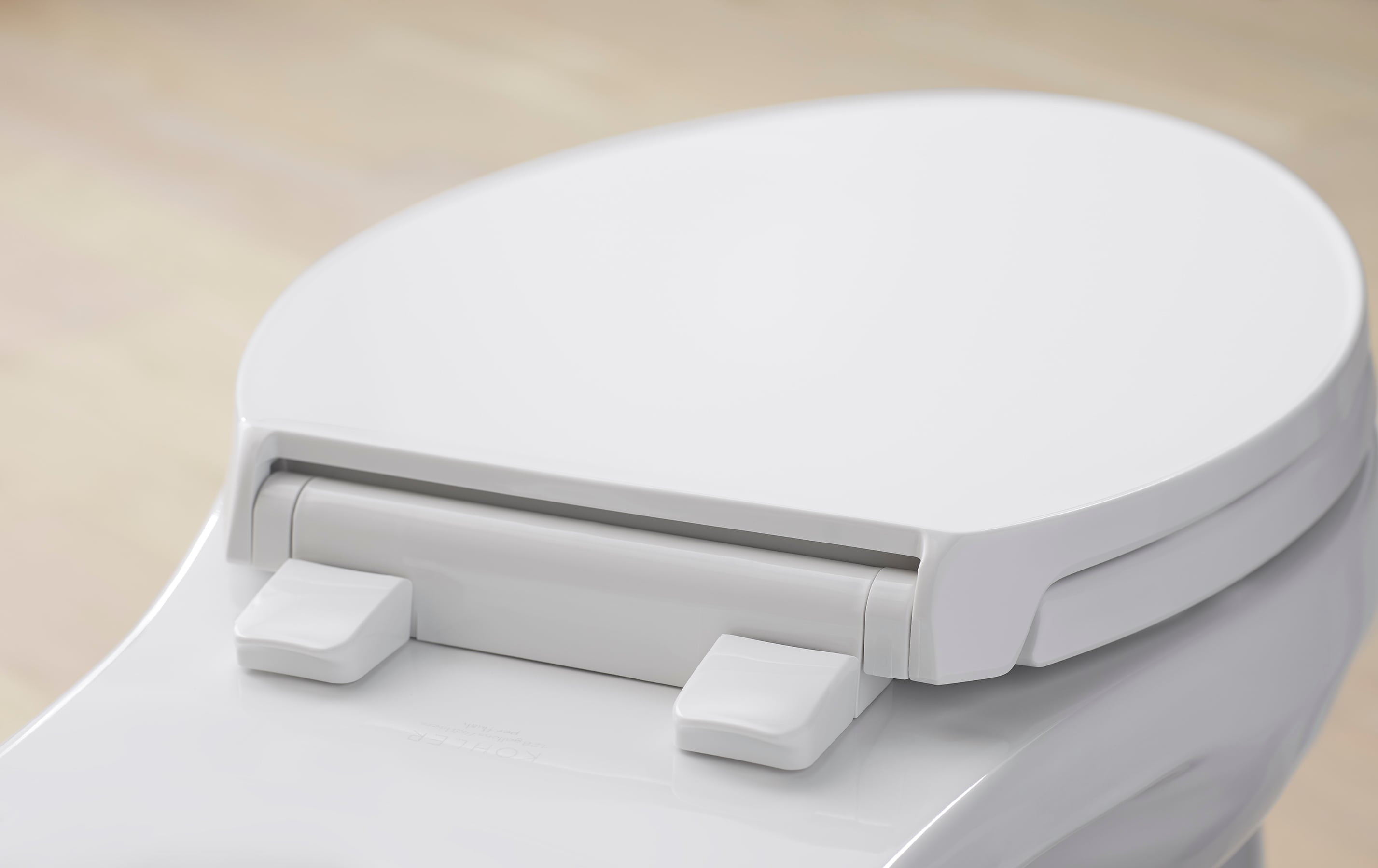 Asiento de inodoro alargado de cierre suave en plástico blanco KOHLER Border K-24495-A-0